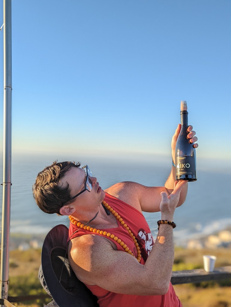 Man displaying wine bottle
